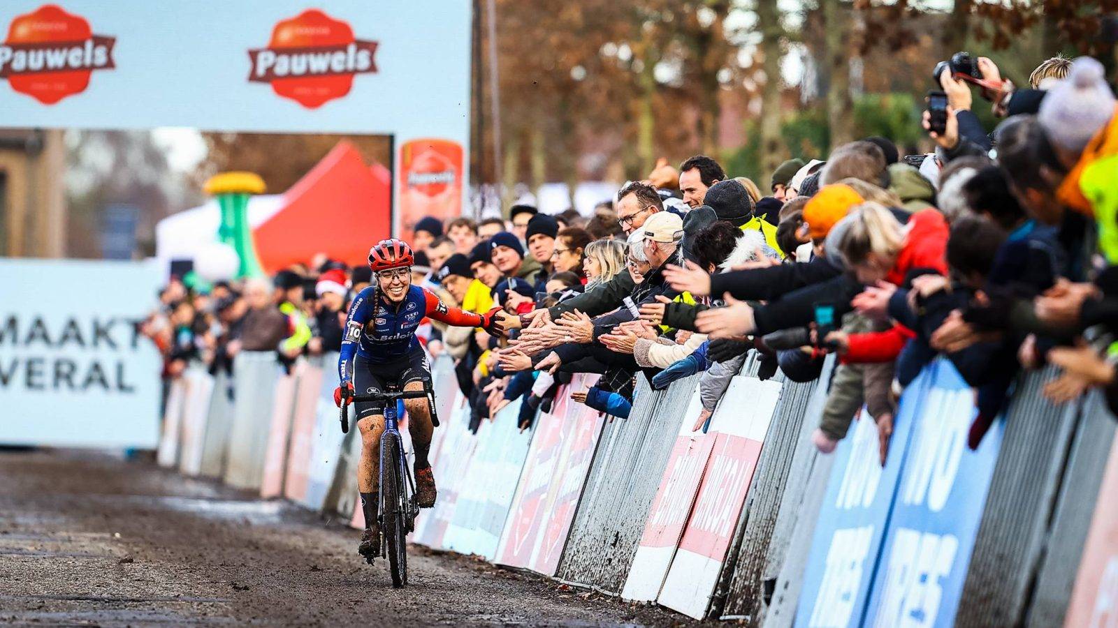 Dutch Shirin van Anrooij celebrates as she crosses the finish line to win the women's elite race of the World Cup cyclocross cycling event in Gavere on Monday 26 December 2022, stage 11 (out of 14) of the UCI World Cup competition. BELGA PHOTO DAVID PINTENS